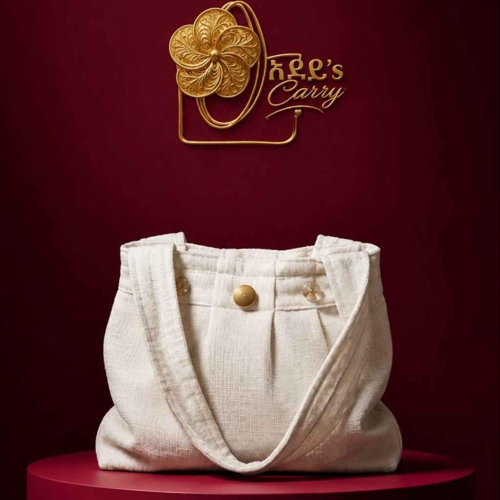 Adeys carry bag showcasing signature stitching, logo, and textured fabric with a spacious interior